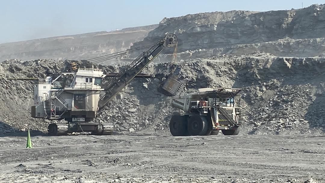 Cat 7495 Electric Rope Shovel loading Liebherr T284 Electric Drive Truck - Skilled Migration Group