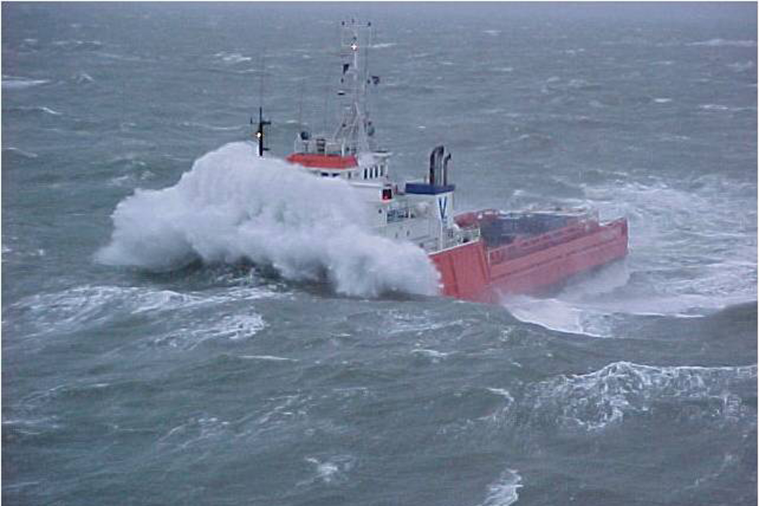 Oil rig tender in rough seas - Caterpillar gear is tough, overseas recruitment of Caterpillar marine fitters